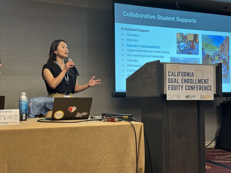 Staff member giving speech at dual enrollment conference