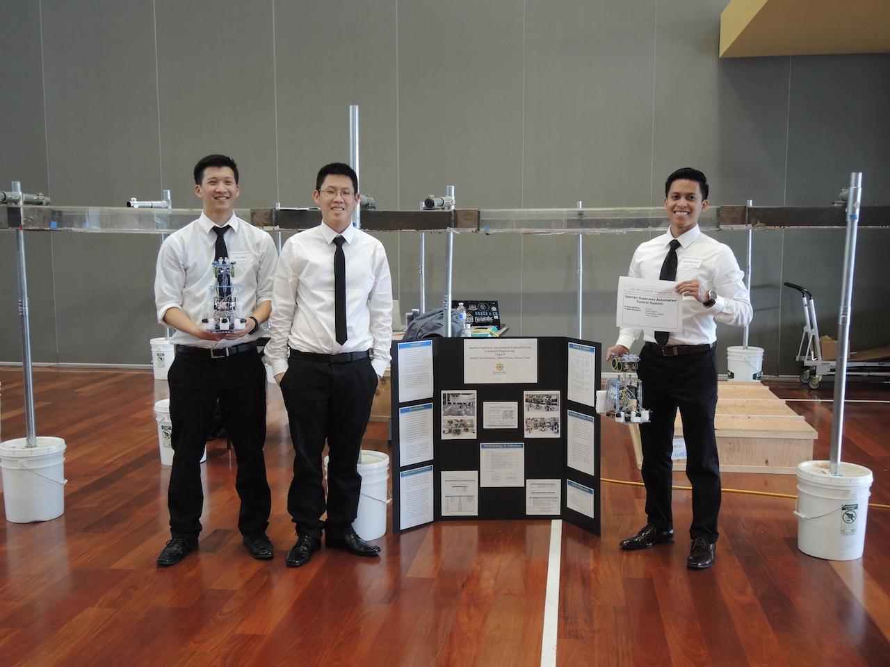 Students showcasing their display for CMPE 2014.