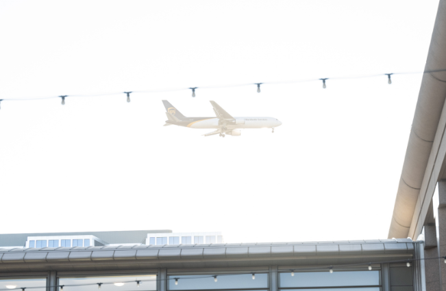 Airplane flying over Spartan Village on the Paseo